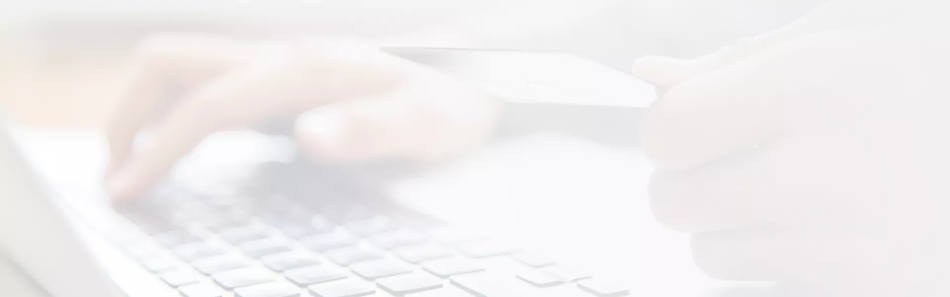 hands-holding-credit-card-typing-laptop