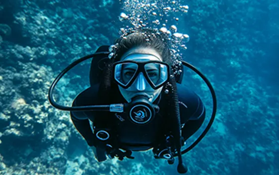 A woman scuba diving underwater